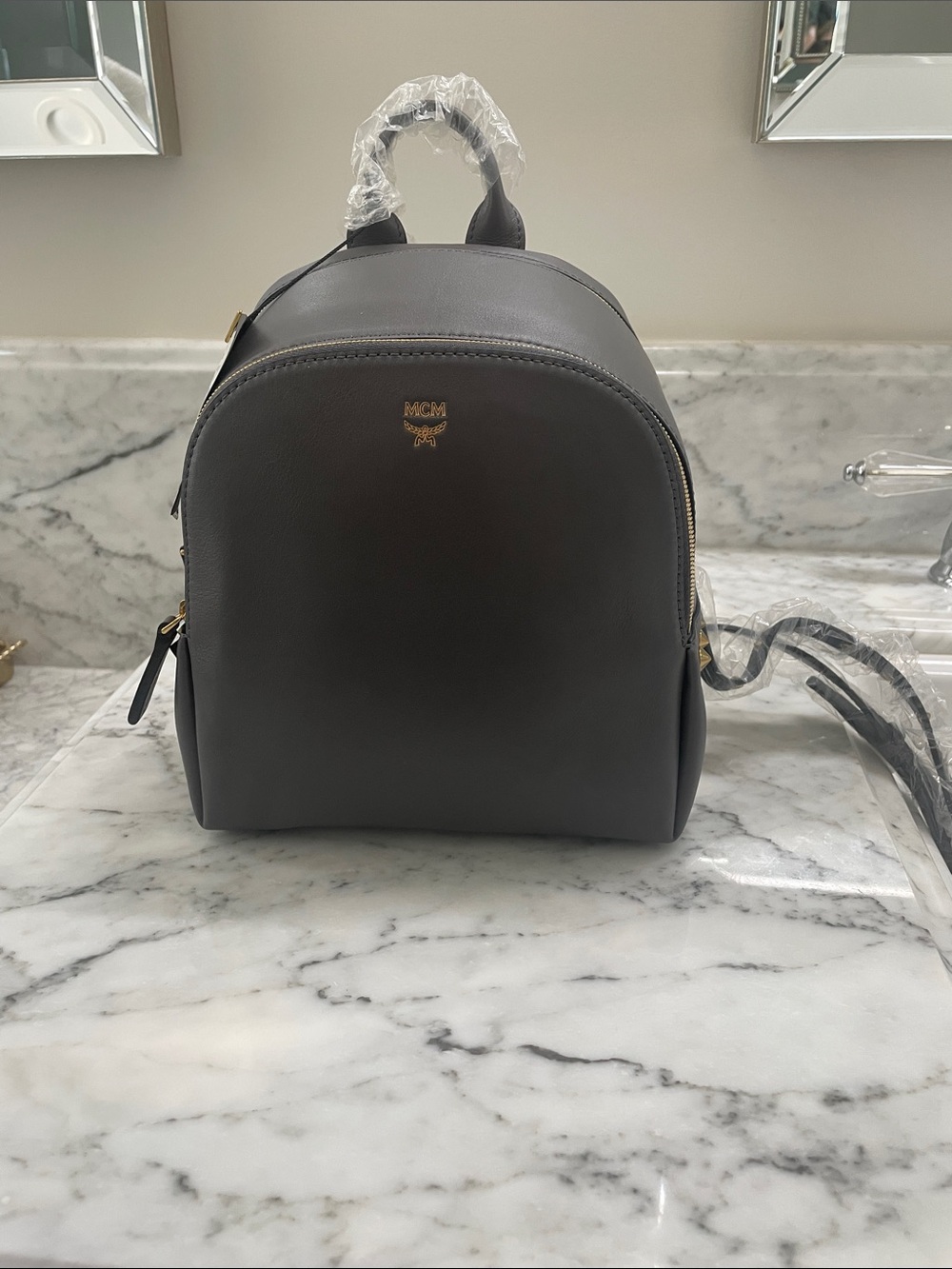 MCM Small Leather Backpack in Dark Gray with Gold Hardware